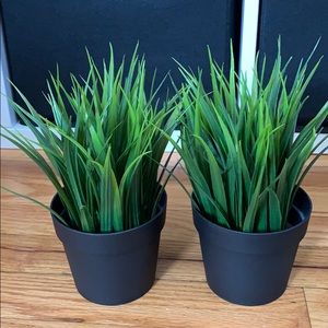 Two potted artificial plants